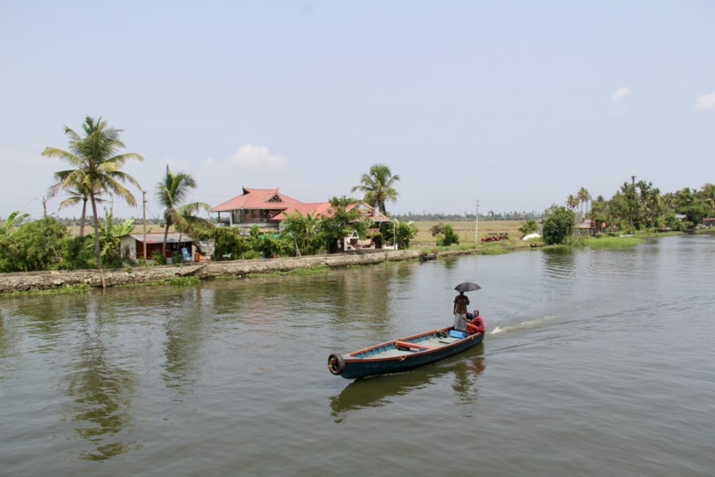 Locals boating along the Kerala Backwaters