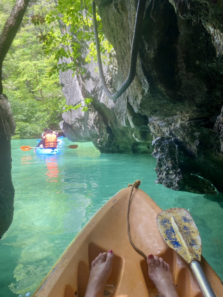 Kayaking through a hidden cave in the Big Lagoon, El Nido, Philippines