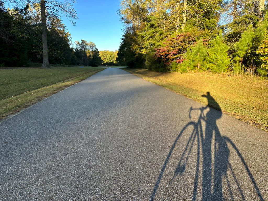 Reflection of a bicyclist at golden hour