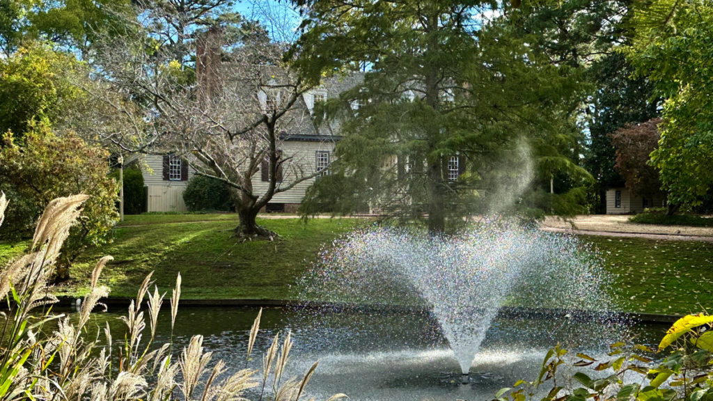 Colonial Williamsburg fountain in pond