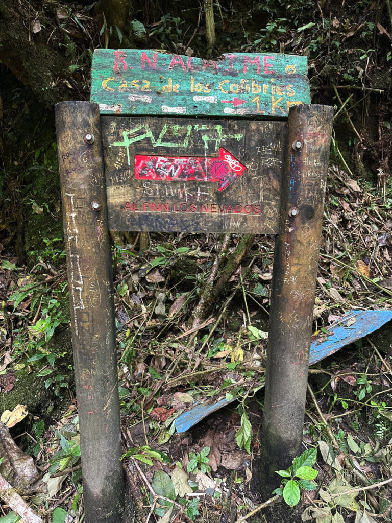 Sign for Hummingbird House to the right