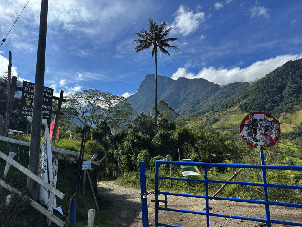 Blue gate at entrance to Cocora Valley trail when hiking counter-clockwise