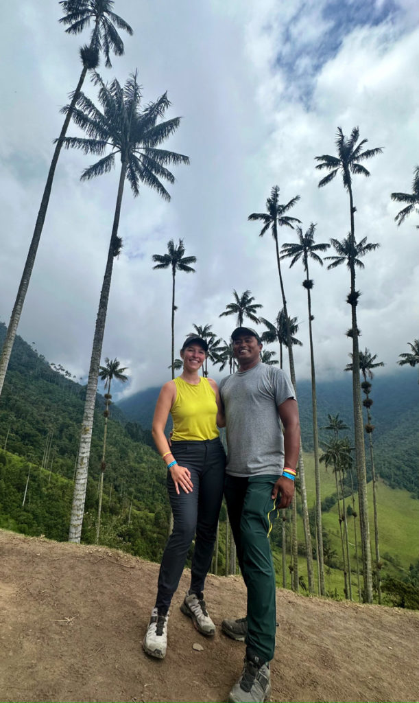 Posing in front of towering wax palms